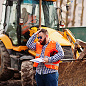 Construction worker operating machinery on site